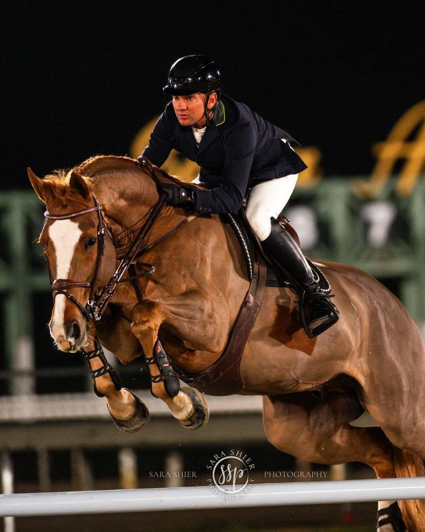 Cassio Rivetti clearing a show jumping fence